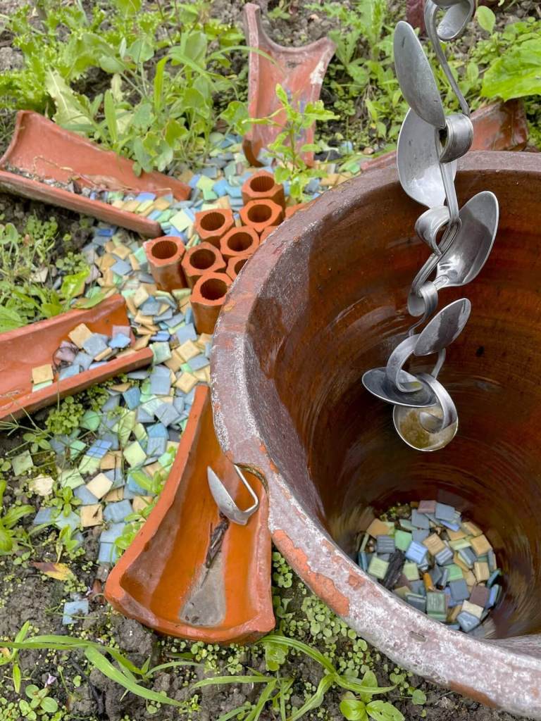 Detail of rainwater chain made from spoons