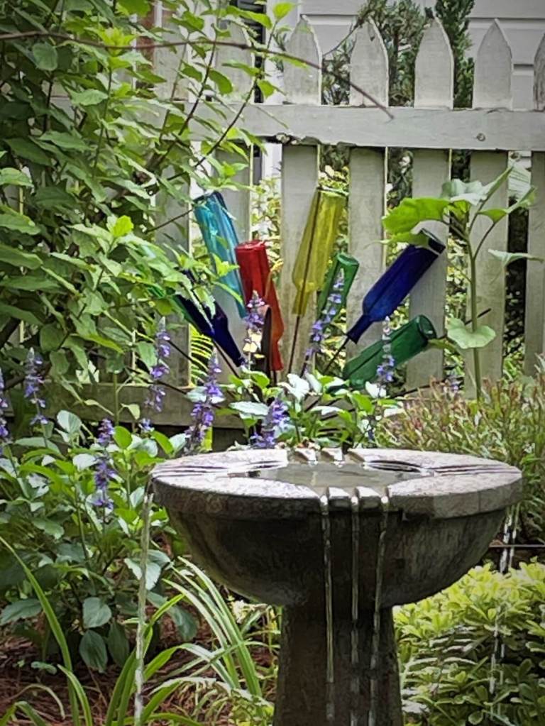 Colourful bottle tree with water feature