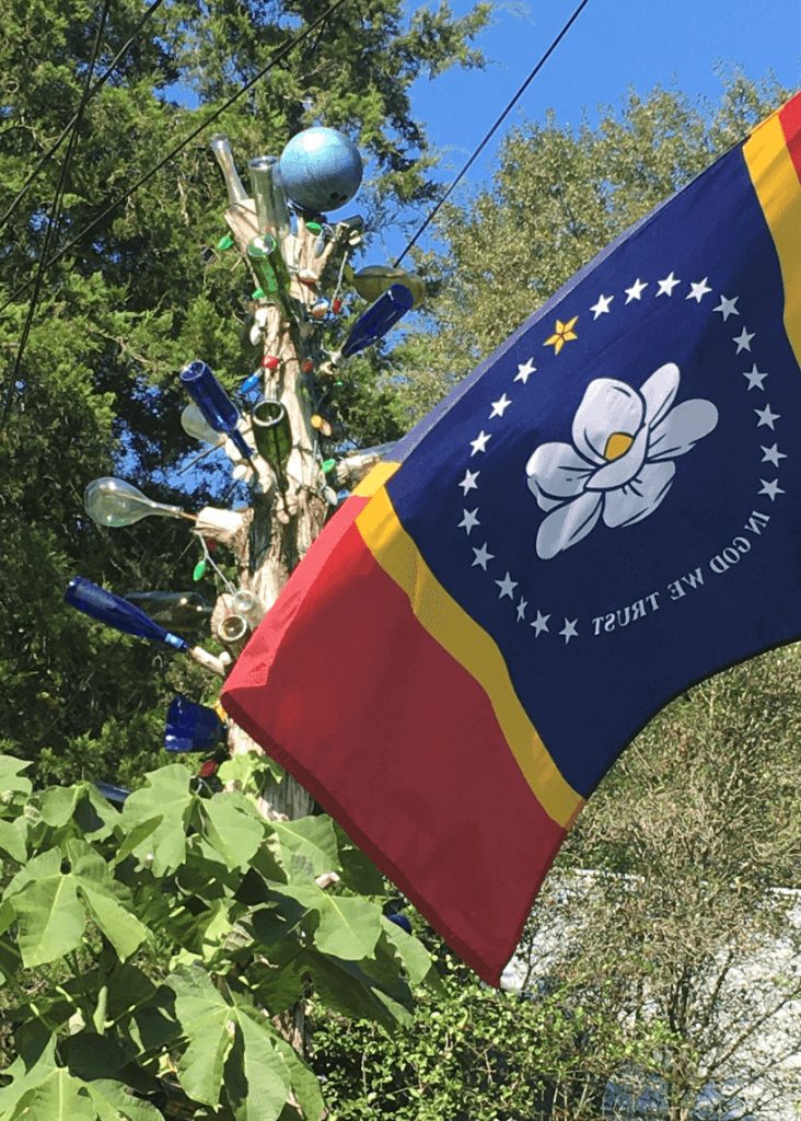 Fondren's tallest bottle tree with state flag
