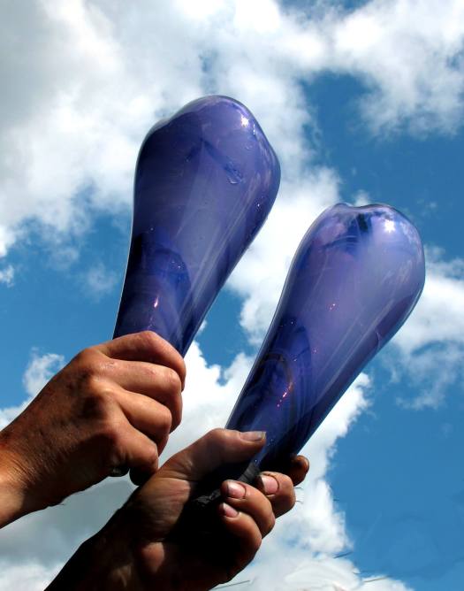 Holding blue glass to the sky