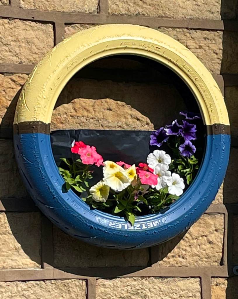 Tyre hanging basket with flowers