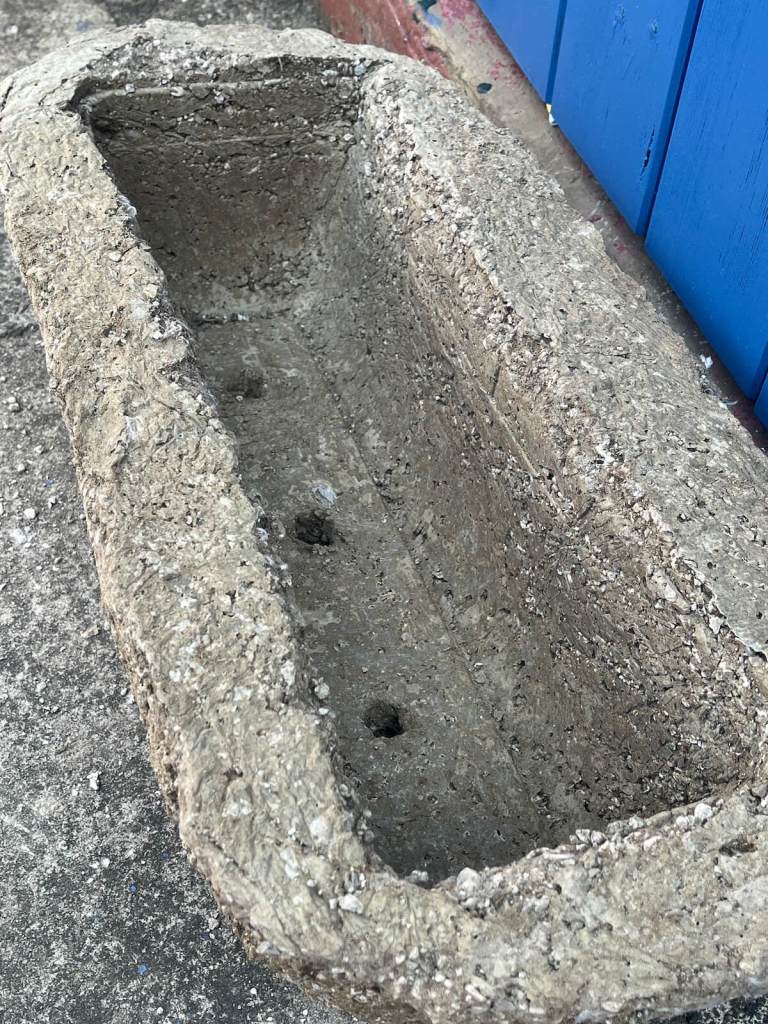 Trough after curing for a few days, showing the drainage holes